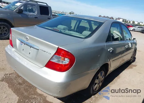 2002 Toyota Camry Le z USA, uszkodzony, nr VIN JTDBE32K320040988